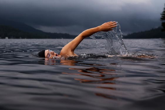 Person Swimming in Lake